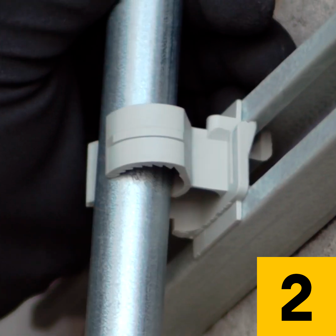 Push the conduit inside the clamp